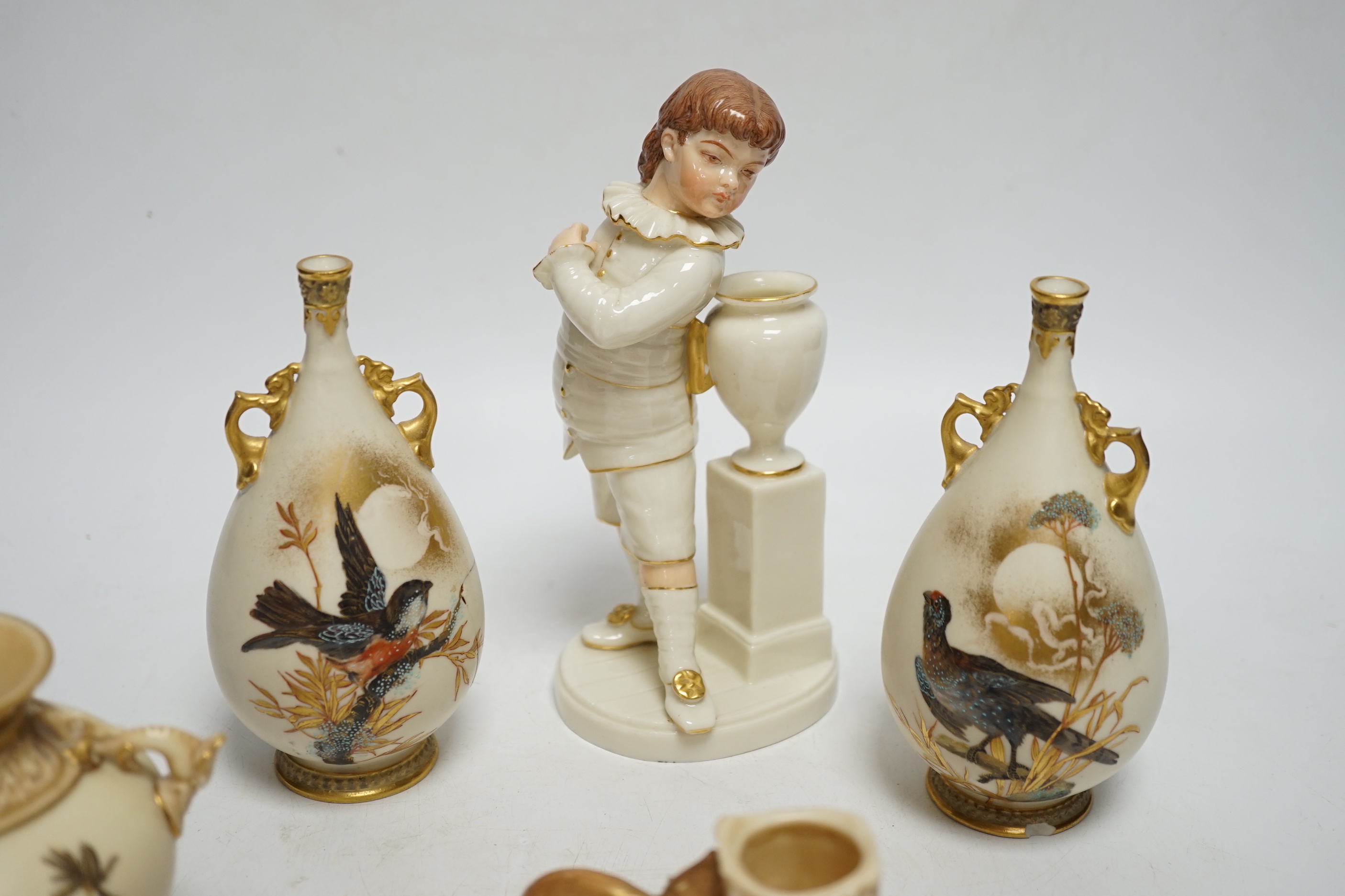 A group of five late 19th century Worcester ceramics, to include figure of a boy, a chamberstick formed as a mouse and candle, an Aesthetic period vase and a pair of bird painted vases